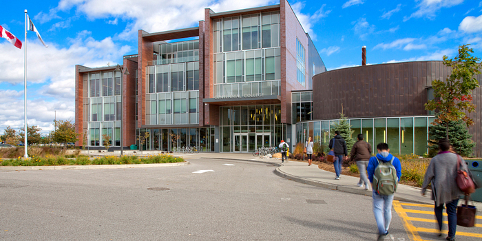 picture of centennial college students walking outside progress campus